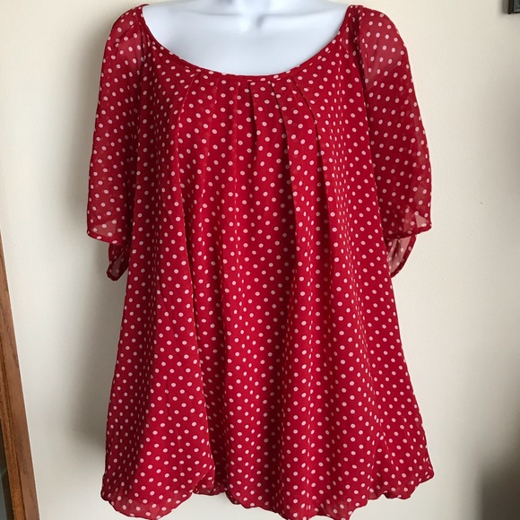 white and red polka dot blouse